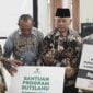 Penyerahan program bantuan rutilahu oleh Baznas Ciamis.